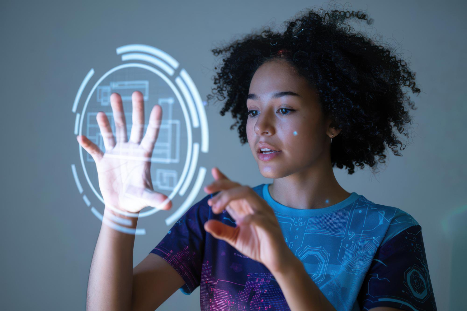 A person interacting with a holographic interface